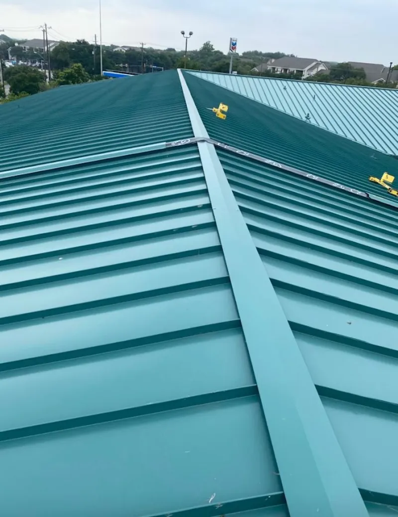 Green commercial metal roof ridge and valley for Metal Roof Repair in Bainbridge